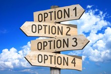 Wooden Signpost With Four Arrows - Option 1, Option 2, Option 3, Option 4 - Great For Topics Like Choice, Making Decision Etc.