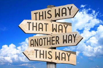 this way concept - wooden signpost