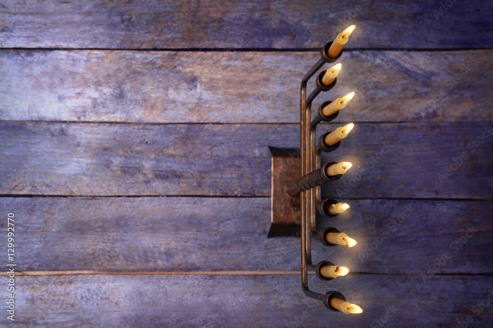 Menorah with candles for Hanukkah on  wooden background