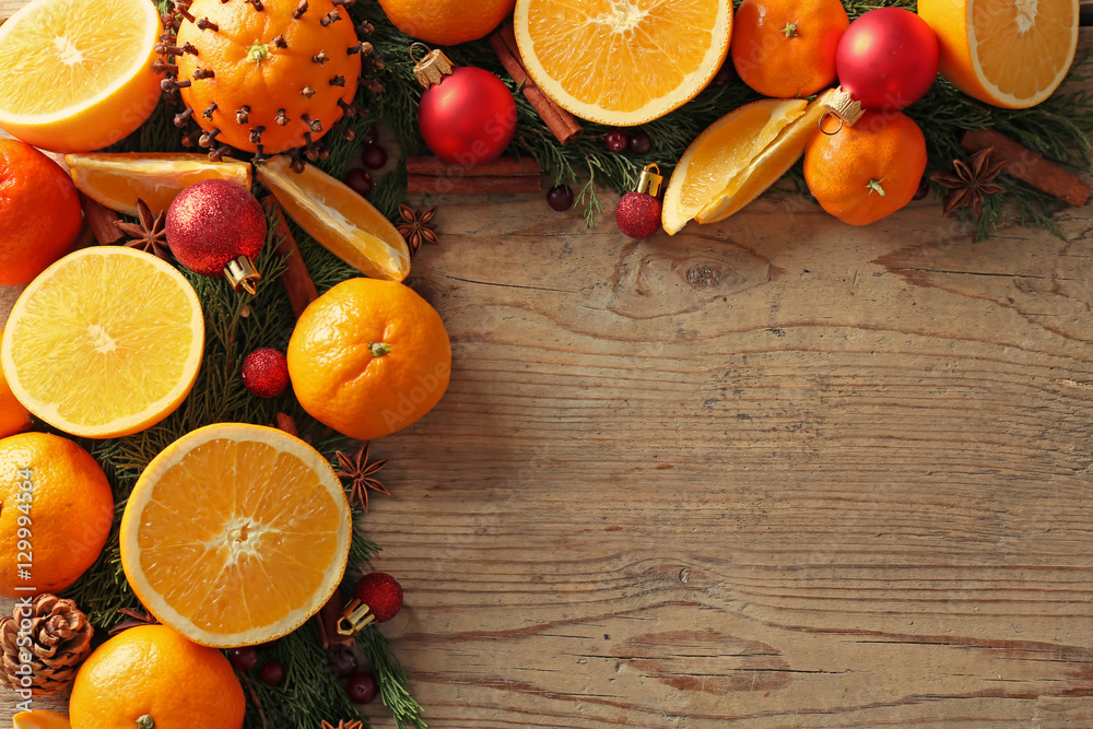 Composition of citruses and spices on wooden background