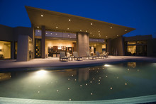 Luxurious And Modern House With Swimming Pool At Night