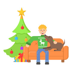 Wall Mural - Christmas character young man in red pullower with deer sitting on couch with dog