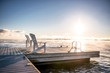 Muskoka Adirondack chairs at sunrise on the dock