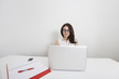 © MDBPIXS - Portrait of young businesswoman in nerd glasses with laptop at desk in office
