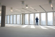 © MDBPIXS - Rear view of mature businessman visiting empty office space