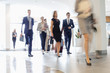 © MDBPIXS - Blurred motion of business people walking at convention center