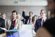 © MDBPIXS - Businessman raising hand during seminar