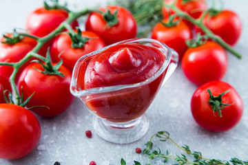Wall Mural - Tomato ketchup sauce with garlic, spices and herbs with cherry t