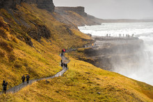 Tourists Visit Gullfoss Waterfall In Iceland