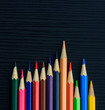 Color pencils on black wood background