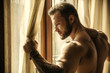 Portrait of sexy shirtless muscular man next to window curtains during the day, wearing only jeans