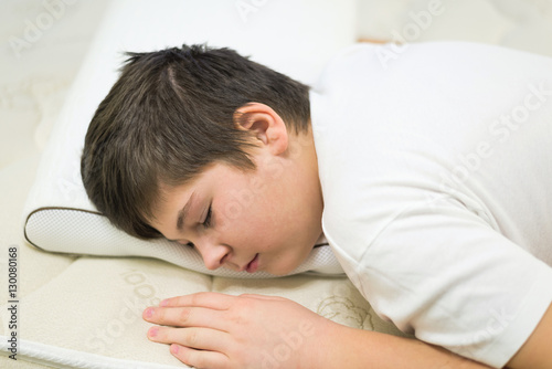 Boy Teenager Sleeping Face Down On Anatomic Pillow Buy This