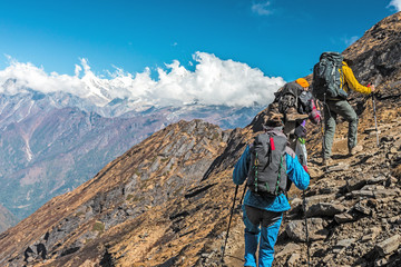 people travelling in mountains on extreme terrain