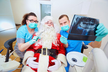 Funny Concept Of Santa Claus At The Dentist's Office On Christmas Day.