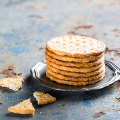 Homemade shortbread cookies with quinoa on old metal background with copy space.