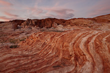 Orange And White Sandstone Layers With Colorful Clouds At Sunrise, Valley Of Fire State Park, Nevada