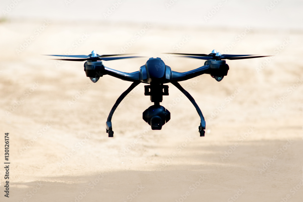 drone landing on the sand - obrazy, fototapety, plakaty 