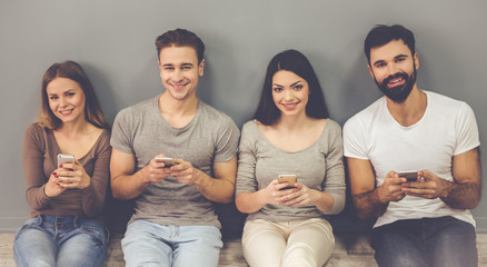 Wall Mural - Young people with gadgets