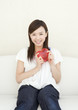 © imagenavi - Woman Holding Heart Shaped Toy