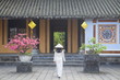© robertharding - Woman wearing Ao Dai dress at Left House inside Citadel, Hue, Thua Thien-Hue, Vietnam