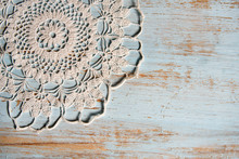 Handmade Lace On Shabby Chic, Painted, Blue Wood. Macrame Close-up, Top View With Copy Space. Wedding Or Holiday Background.