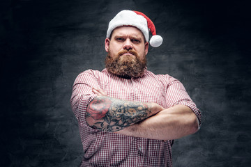 Wall Mural - Bearded male wearing Santa's New Year hat.