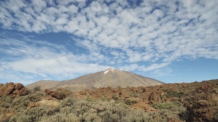 Wall Mural - Footage of dramatic volcanic landscape with majetic Teide volcano in a background, Tenerife, Canary Islands, Spain.