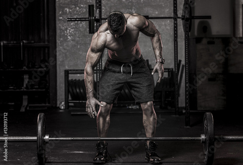 Muscle Man about to Pickup Barbell Fototapet