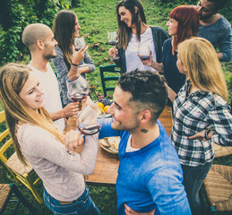 Wall Mural - Friends having dinner in garden