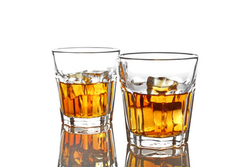 Wall Mural - Glasses of whisky with ice isolated on white