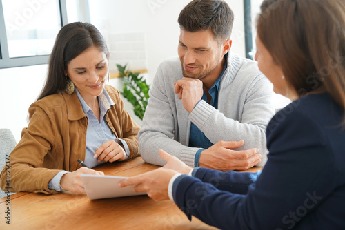 Fotografie, Obraz Couple meeting financial adviser for home investment contract