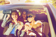 © Syda Productions - happy teenage girls or young women driving in car