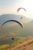 Paragliders in sunny day flying in Palava, hill Devin, South Moravia, Czech Republic