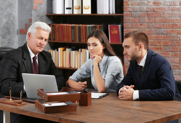 Wall Mural - Young couple with notary at office