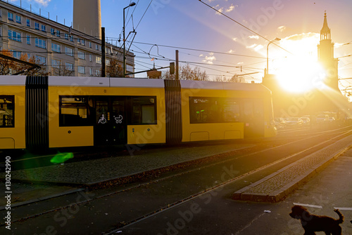 Leinwand Poster Modern electric tram yellow color on the streets of Berlin