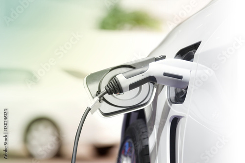 Fotografía Charging an electric car, Future of transportation