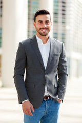 Wall Mural - Portrait of an handsome businessman in an urban setting