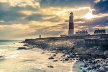 Dramatic Sunset With Iconic Lighthouse On Coast