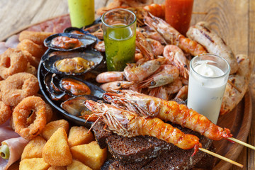 Wall Mural - Seafood platter on wooden table background