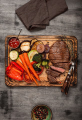 Wall Mural - Cooked grill dish with cut meat, top view