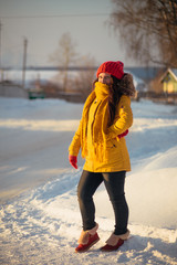 Portrait of romantic girl at sunset, sunrise, gold per hour on a frosty winter day