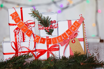 Wall Mural - Group Christmas white gift boxes with red ribbons and garland Merry Christmas.