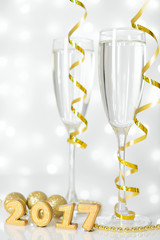 Two glasses of champagne and New Year decorations