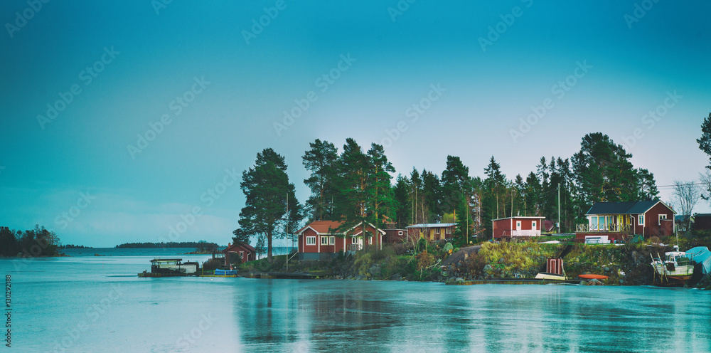 Fisherman village in Sweden at winter after sunset - winter seasonal scandinavian background - obrazy, fototapety, plakaty 