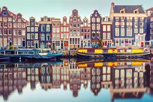 Amsterdam Canal Singel With Typical Dutch Houses And Houseboats During Morning Blue Hour, Holland, Netherlands. Used Toning