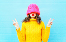 Fashion Young Woman Blowing Red Lips Makes Air Kiss Wearing Knit