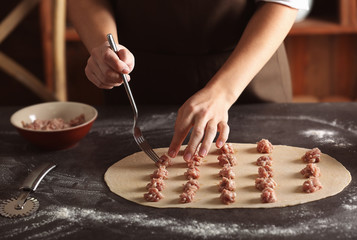 Poster - Woman making ravioli on table