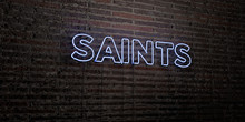 SAINTS -Realistic Neon Sign On Brick Wall Background - 3D Rendered Royalty Free Stock Image. Can Be Used For Online Banner Ads And Direct Mailers..