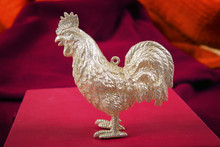 Figure Of A Gold Rooster A Symbol Of 2017 On A Red Background