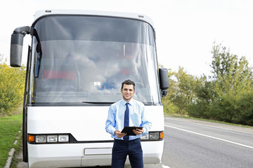 Wall Mural - Driver standing in front of bus